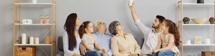 3 generations of family sitting on a couch