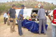 DEAD END: Six would-be robbers were gunned down in Kameeldrift in northeastern Pretoria after they tried to hijack a cash-in-transit van yesterday. Three of the robbers escaped in a getaway car and the six bodies of those killed were loaded into a forensic van. Pic: PEGGY NKOMO. 14/09/2009. © Sowetan.