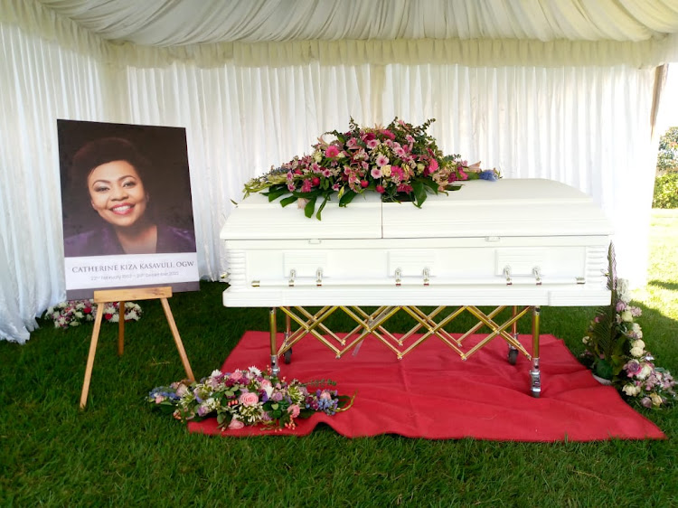 The remains of Catherine Kasavuli lie in a casket at the funeral ervice in Vihiga County. January 14, 2022.