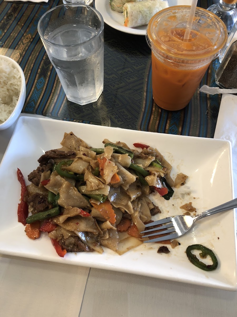 drunken rice noodles with beef and thai ice tead with coconut milk