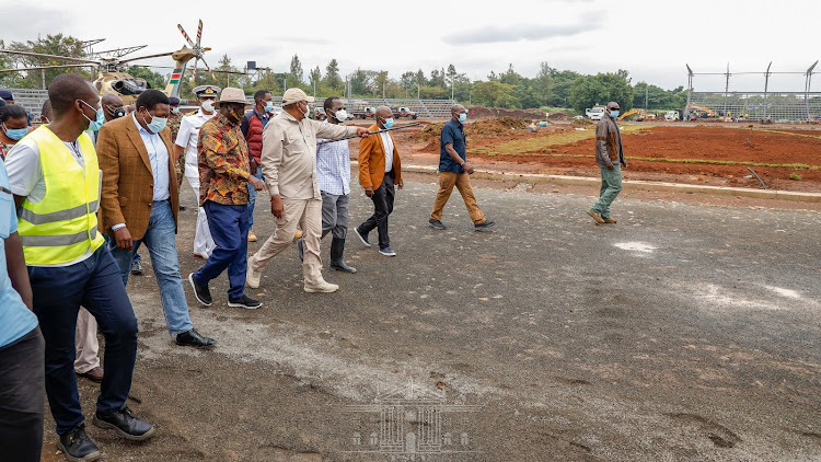 President Uhuru Kenyatta accompanied by former Prime Minister Raila Odinga when he inspected the ongoing construction of the Sh415 million Jomo Kenyatta Stadium in Mamboleo, Kisumu County on January 10, 2021.