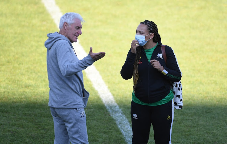 Bafana Bafana head coach Hugo Broos and Safa media officer Romy Titus during the national soccer team's training session at Dobsonville Stadium on October 5, 2021 in Johannesburg.