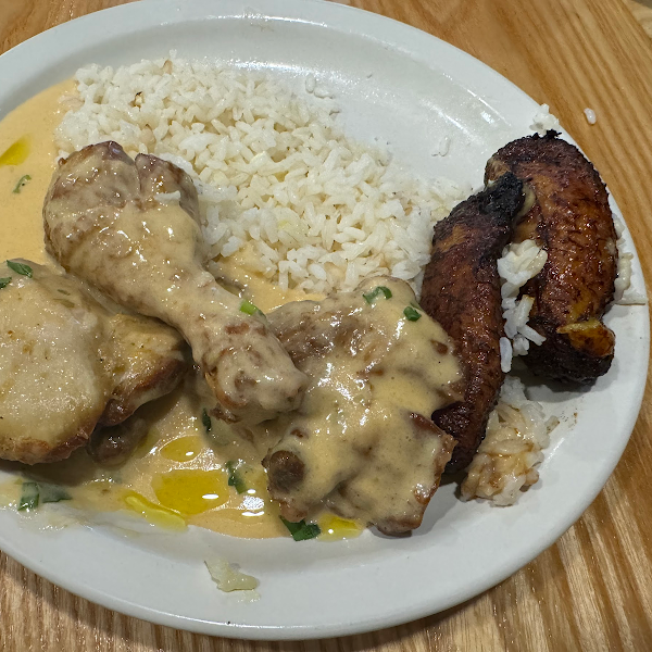Seco de pollo with white sauce subbing for beer reduced usual sauce
