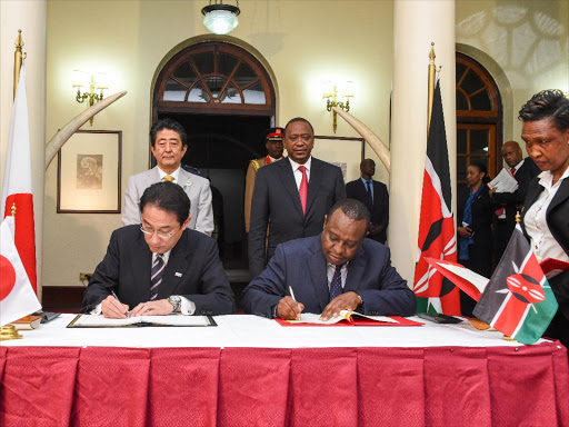 President Uhuru Kenyatta and Japan's Prime Minister Shinzo Abe witness the signing of agreements between Kenya and Japan at State House, Nairobi. /PSCU