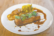 The Blockhouse Kitchen's hot-smoked Chinese BBQ pork belly, sweet and succulent with sticky hoisin and ginger, served with cucumber pickles and smashed new potatoes.