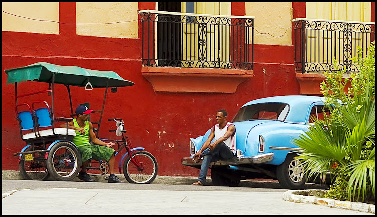 Cabbies at the Red Wall in Santiago de Cuba, Cuba.