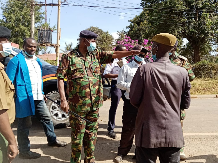 Kirinyaga county police commander Mathew Mang'ira ordering the demonstrating riders to clear the road.