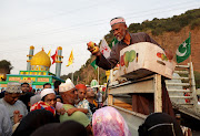 Thousands of Muslims in Durban receive food and blessings as they celebrate the Islamic holy day. 