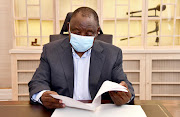 President Cyril Ramaphosa reads through his state of the nation address notes on Thursday, just hours before speaking in parliament.