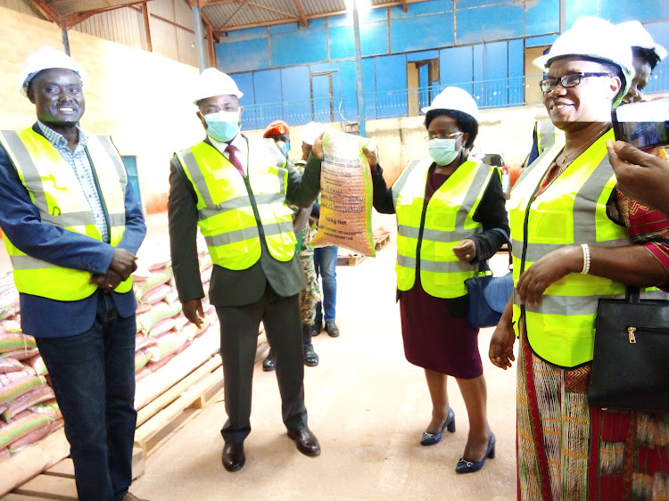 Ministers of Agriculture,Karamoja , NAADs Executive Director and members of Parliament verify seeds before dispatch to the people of Karamoja.