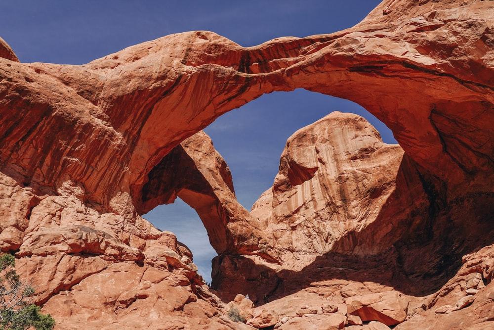 brown rock formation under blue sky during daytime