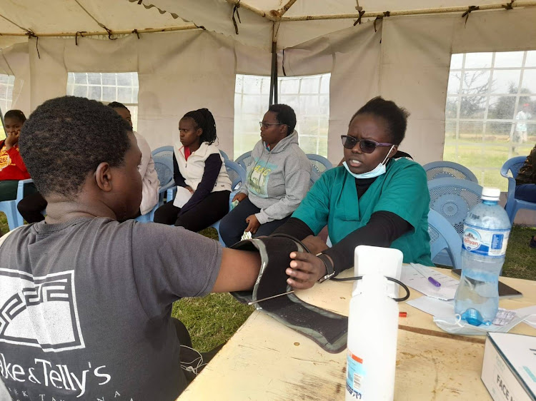 Murera residents being attended to by medics during the free medical camp.