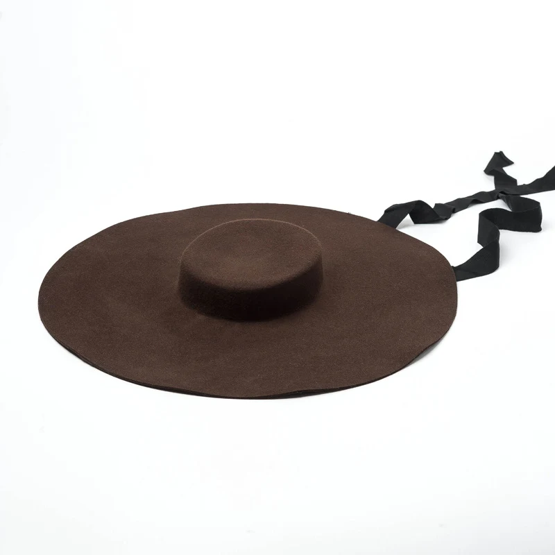 European and American new fashion large brim wool hat. Stay stylish and protected with this elegant flat-top wool hat.