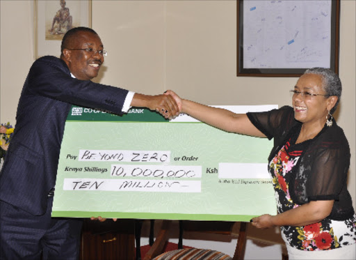 FOR A GOOD CAUSE: Cooperative Bank CEO Gideon Muriuki hands a Sh10 million cheque to First Lady Margaret Kenyatta yesterday. Photo/Correspondent