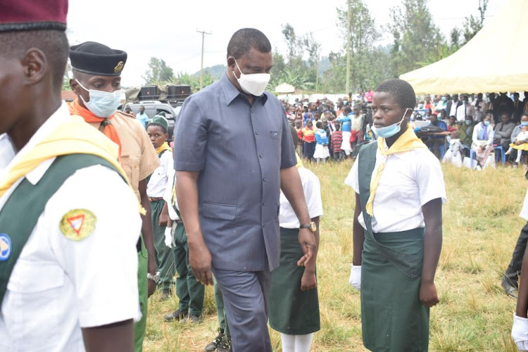 Speaker of the National Assembly Justin Muturi inspects a guard of honour by pathfinders at Athiru Gaiti,Igembe South on Saturday.