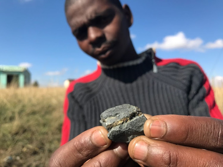 KwaMachi resident Thulani Ncayiyane with a "gold" nugget recovered from a quarry in KwaZulu-Natal.