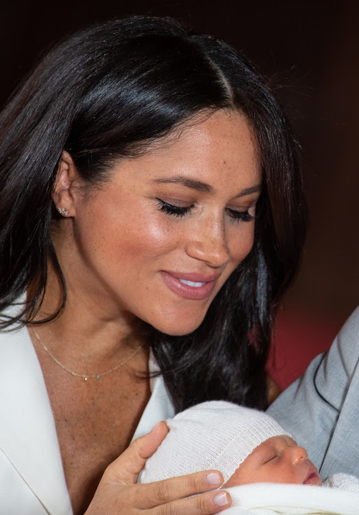 Meghan, Duchess of Sussex, poses with her son, Archie Harrison Mountbatten-Windsor, at Windsor Castle on May 8 2019 in Windsor, England.