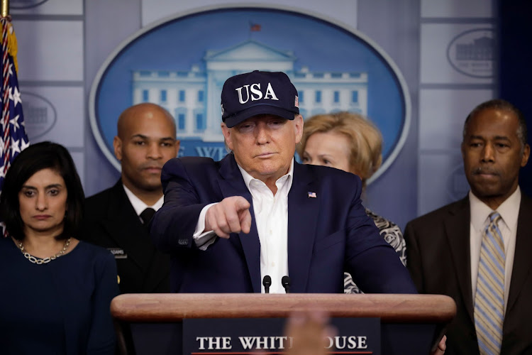 U.S. President Donald Trump holds a press briefing with members of the Coronavirus Task Force at the White House in Washington, U.S., March 14, 2020. REUTERS/Yuri Gripas