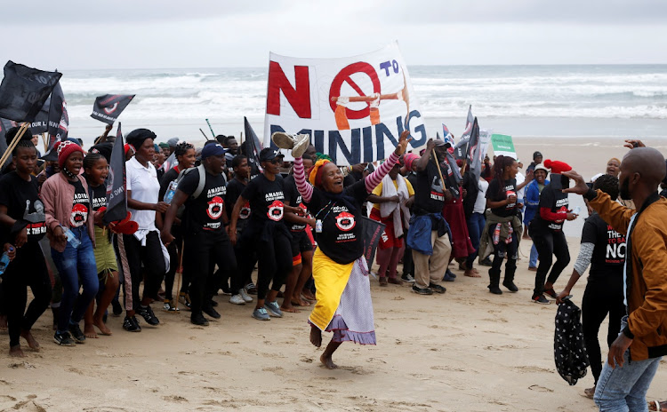Residents demonstrate against Royal Dutch Shell's plans to start seismic surveys to explore petroleum systems off the Wild Coast at Mzamba Beach in Sigidi on December 5 2021.