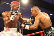 Phumelela ‘The Truth’ Cafu lands a left hook on Ben Mananquil of the Philippines. 