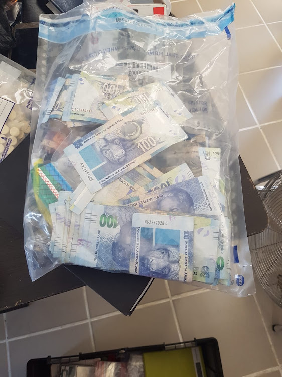 Money and drugs were among some of the items recovered during the series of busts on Monday. This stash of cash was confiscated during a bust in Mthatha.