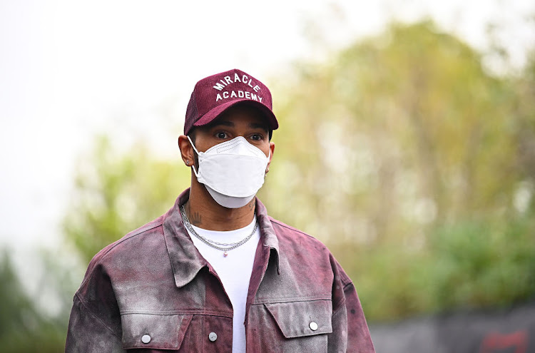 Lewis Hamilton walks in the Paddock during previews ahead of the F1 Grand Prix of Emilia Romagna at Autodromo Enzo e Dino Ferrari on April 21, 2022 in Imola, Italy.