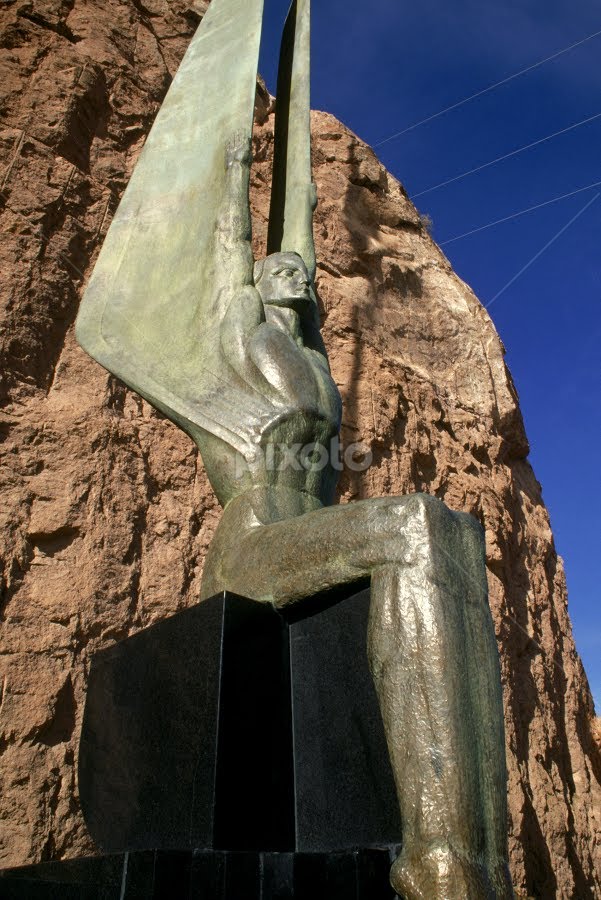 Statue at Hoover Dam by Gayle Mittan - Buildings & Architecture Statues & Monuments ( winged, winged figure, statue, tourism, sculpture, angel, bronze, mountain, canyon, outdoors, art deco, hoover dam, travel, daytime, object )