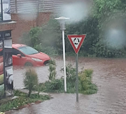 A car was caught in the flood in Montana, Tshwane, on Friday afternoon.