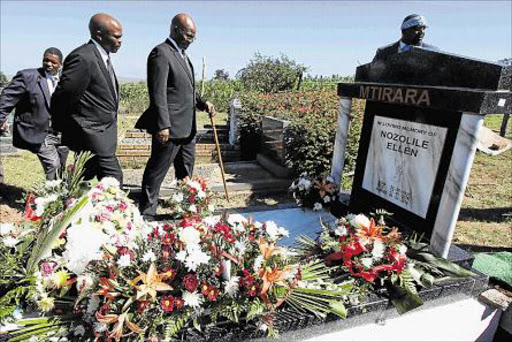 PAYING RESPECT: AmaDlomo elder Nkosi Ngangomhlaba Matanzima, with walking stick, and Daludumo Mtirara attend the funeral of Nozolile Mtirara at Mqhekezweni Great Place in Mthatha on Saturday