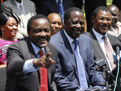 Cord principals Kalonzo Musyoka, Raila Odinga and Moses Wetangula share a light moment during a press conference at Orange house. Photo/Monicah Mwangi