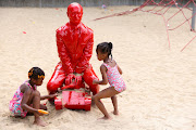 Children play with a statue of Russian President Vladimir Putin riding a tank created by French artist James Colomina in Central Park in Manhattan, New York City, US, on August 2 2022. 