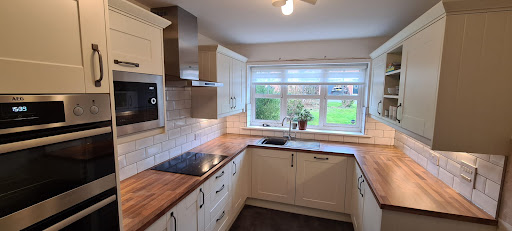 Cream shaker Wren kitchen, with light walnut luxury laminate and under-counter lighting. New socket frontals and all electrical work carried out by DKL Electrical.
