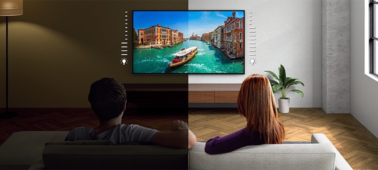 Image of couple on sofa watching TV with screenshot of boat on river showing benefit of Light Sensor