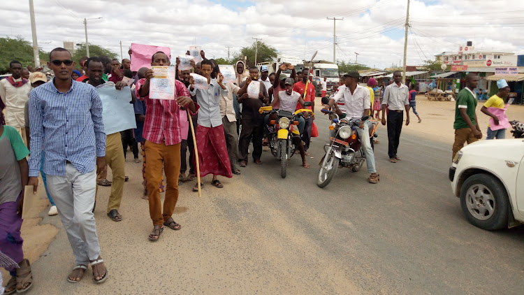 Madogo traders protest overtaxation by Garissa county government along the Garissa-Nairobi road on Friday May 10, 2019