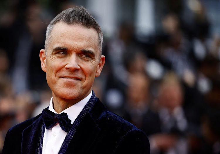 Robbie Williams poses at the Cannes Film Festival in Cannes, France, May 20, 2023.
