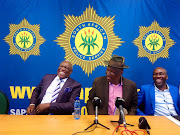 Minister of home affairs Siyabonga Cwele, police minister Bheki Cele and KZN MEC for Transport, Community Safety and Liaison Mxolisi Kaunda share a laugh before addressing the media in Durban on April 3, 2019.