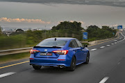 Wide-set LED headlights and taillights are connected by a sharp character line that carries from the front bumper to the rear.