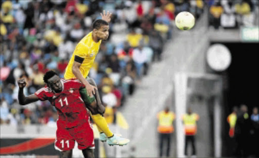 DETERMINED: Bafana Bafana defender Rivaldo Coetzee, seen here fighting for the ball with Salah Ibrahim of Sudan last week, says tonight's match against Nigeria is critical Photo: Veli Nhlapo