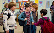 Zachary Gordon, centre, plays Greg Heffley in the first of four movies based on the 'Diary of a Wimpy Kid' novels.