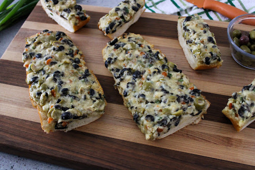 Slices of Garlicky Olive Cheese Bread.