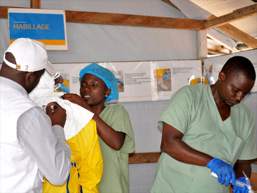 Medical team wear protective suits as they prepare to administer Ebola patient care at The Alliance for International Medical Action (ALIMA) treatment center in Beni. /REUTERS