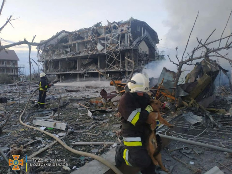 Emergency personnel work near a building damaged after a military strike in Odesa, Ukraine. The country has been forced to spend billions on its war with Russia instead of development, the country’s finance minister said on Thursday.