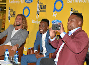 MAGIC FORMULA  Nikolaos Kirkinis,Teko Modise  and Robert Marawa during the launch of 'The Curse of Teko Modise' at the Mall of Rosebank, Johannesburg, on Wednesday.