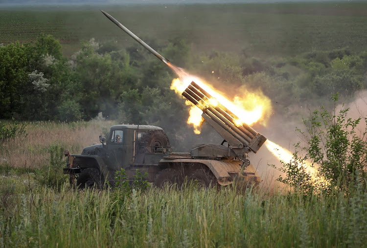 Ukrainian service members fire a BM-21 Grad multiple rocket launch system, amid Russia's attack on Ukraine, near the town of Bakhmut, Donetsk region Ukraine June 12, 2022.