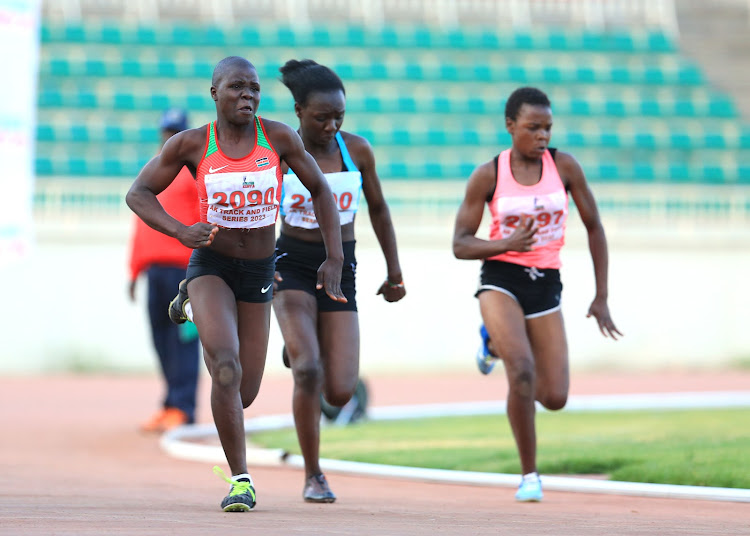 Selpha Ojiambo (L) in action during the under 10 trials at Nyayo national stadium