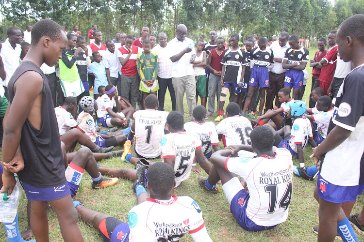 Nduru High School principal and rugby coach J.J. Masime gives tips to his rugby team