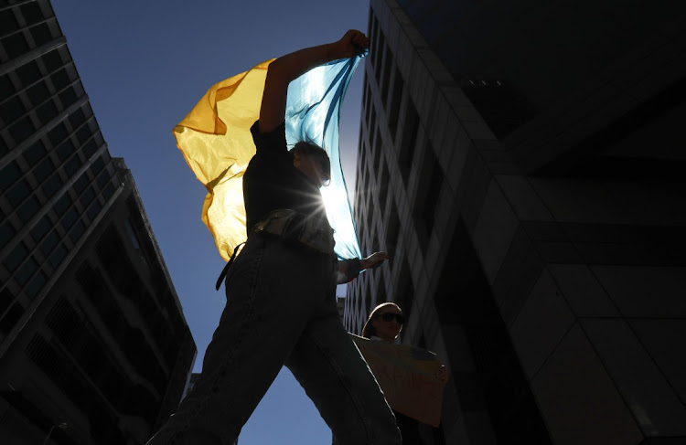 A group of Ukrainian citizens protest outside the Russian embassy in Cape Town on February 25 2022. They are calling for a stop to Russia's incursion into Ukraine.