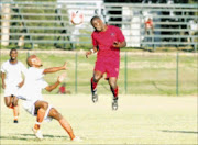 TOP FLYER: Madisha Mojalefa of Jomo Cosmos and Itumeleng Dalane of Dynamos fight for the ball during their National First Division at George Thabe Stadium. Dynamos won 1-0. 19/04/09. Pic. Veli Nhlapo. © Sowetan.