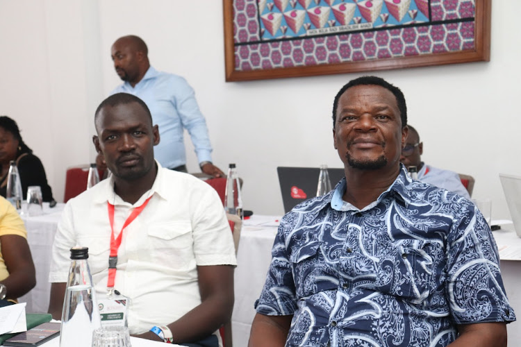 An official with Sirisia MP John Waluke as KBC Managing Director Samuel Maina makes a presentation to a select committee of parliamentarians on January 24, 2023.