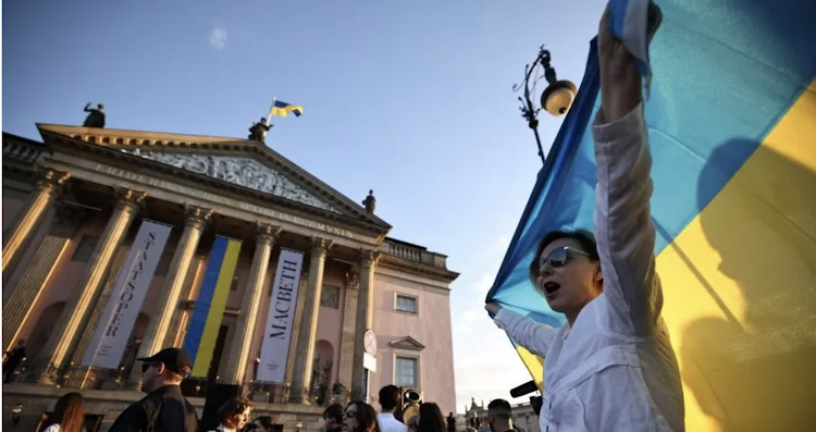 An estimated 200 protesters demonstrated outside the Berlin State Opera on Friday evening